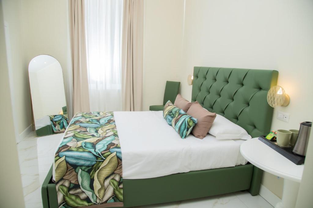Postel nebo postele na pokoji v ubytování Gentile Suite Centro Storico