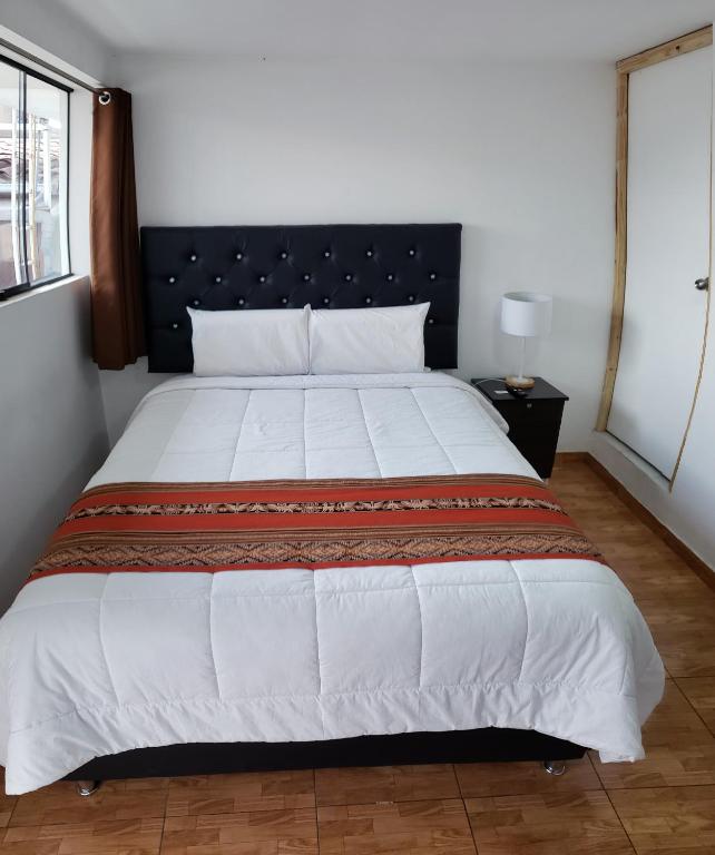 Hostal Cusco de mis Sueños客房内的一张或多张床位