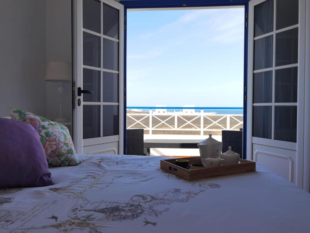 Postel nebo postele na pokoji v ubytování apartamentoscasajulia