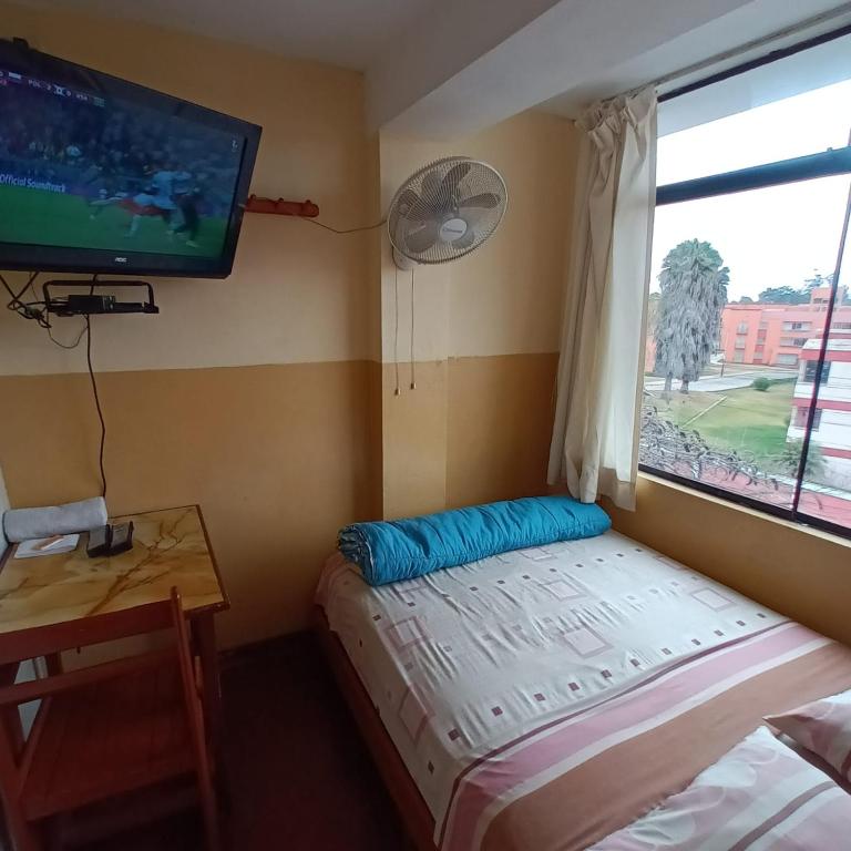 Postel nebo postele na pokoji v ubytování Hostal Jovita
