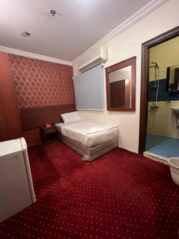 Postel nebo postele na pokoji v ubytování فندق كنان العزيزية Kinan Al Azizia Hotel Makkah