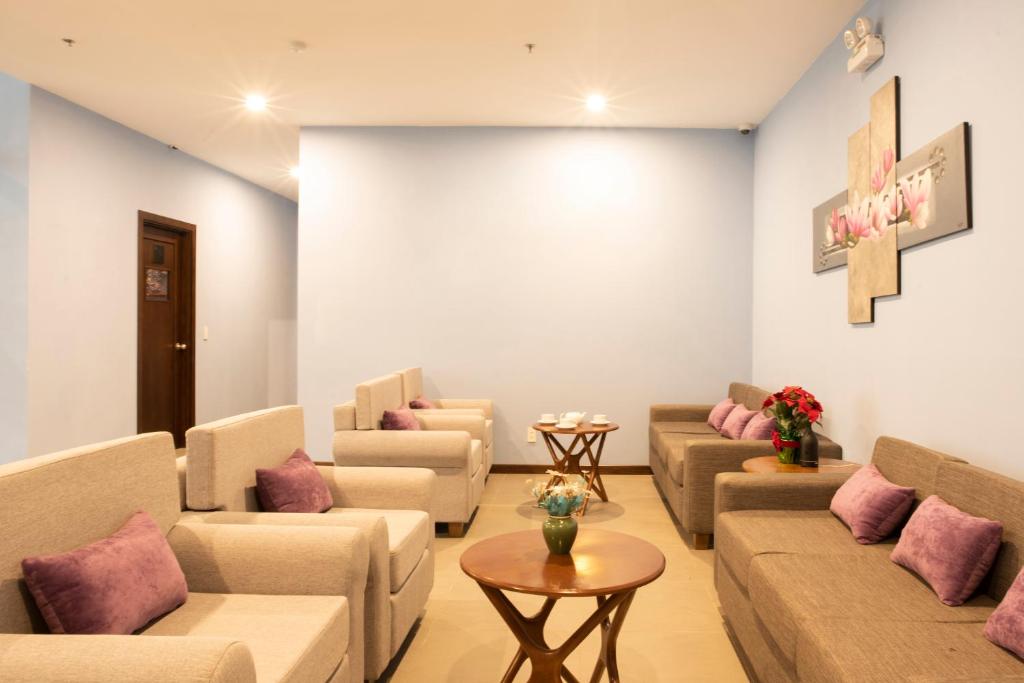 A quiet sitting area furnished with sofas, armchairs, and small coffee tables.