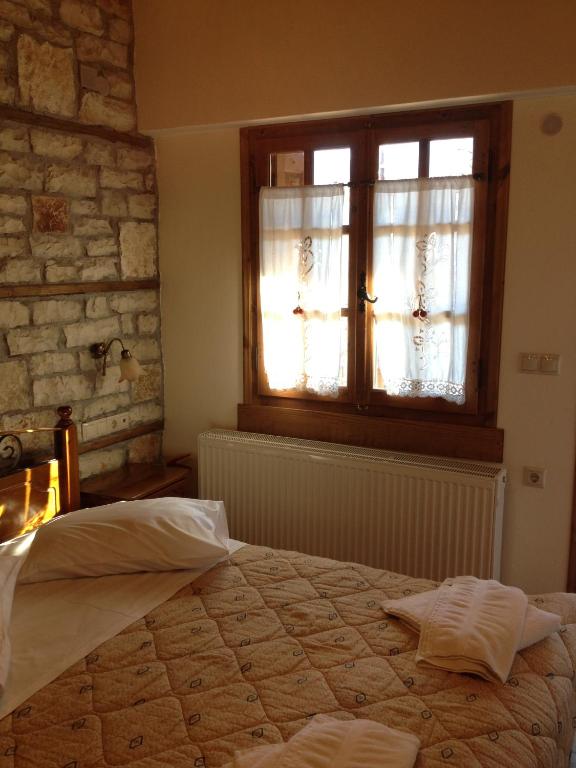 Postel nebo postele na pokoji v ubytování Guesthouse Gonia
