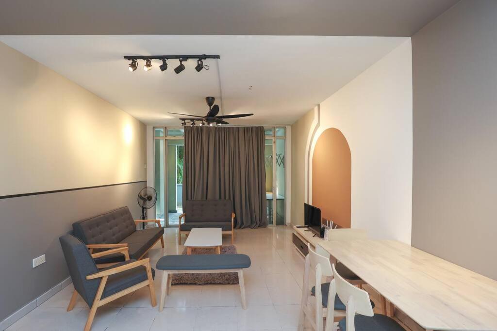 a living room with a table and chairs at Cyberjaya Cyberia landed house BBQ By EC in Cyberjaya