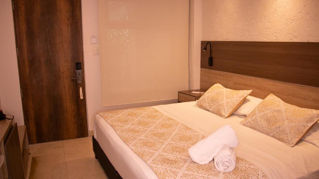 Postel nebo postele na pokoji v ubytování Cartagena Royal Hotel Boutique