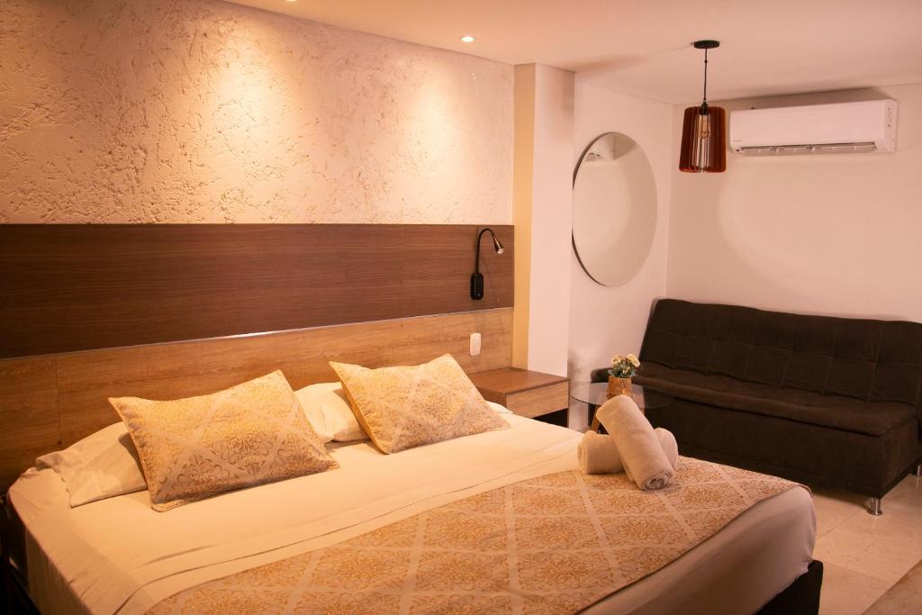 Postel nebo postele na pokoji v ubytování Cartagena Royal Hotel Boutique