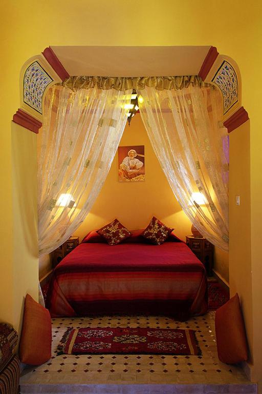 Postel nebo postele na pokoji v ubytování Riad Dar Colline