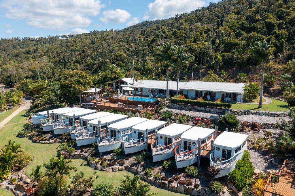 an aerial view of the resort with boats in the yard at Freedom Shores Resort Airlie Beach in Airlie Beach