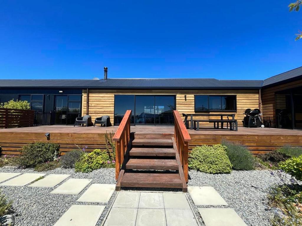 a wooden staircase leading to a house at Wayfarers Lodge in Lake Tekapo