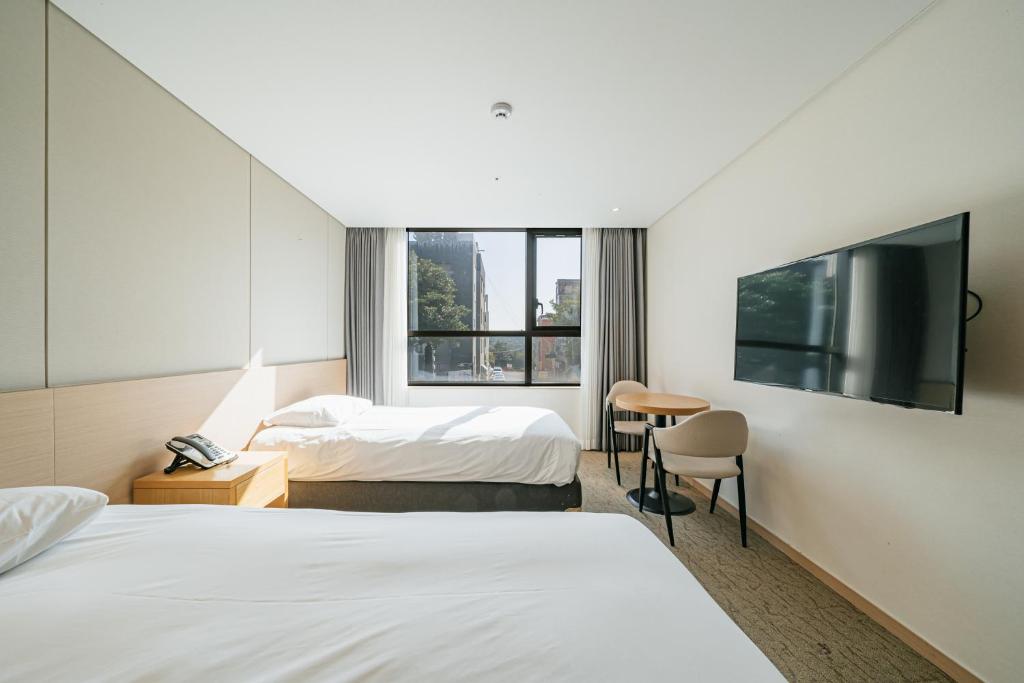 Postel nebo postele na pokoji v ubytování Hotel Zinc