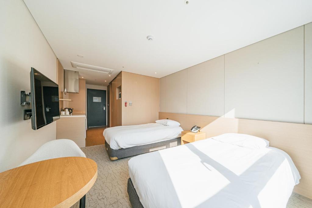 Postel nebo postele na pokoji v ubytování Hotel Zinc