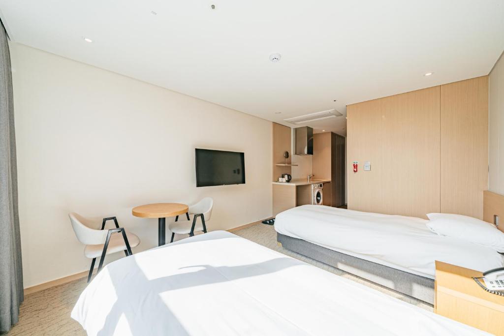 Postel nebo postele na pokoji v ubytování Hotel Zinc