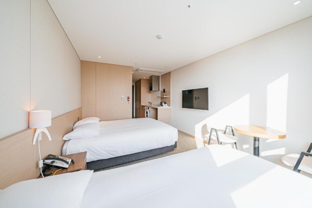 Postel nebo postele na pokoji v ubytování Hotel Zinc