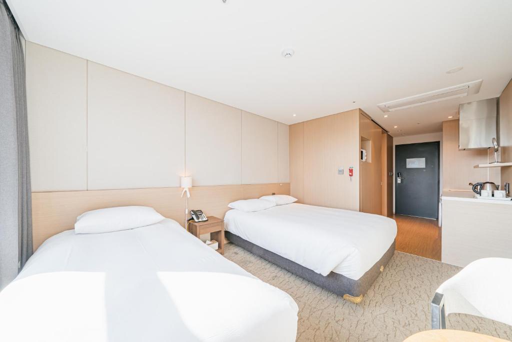 Postel nebo postele na pokoji v ubytování Hotel Zinc