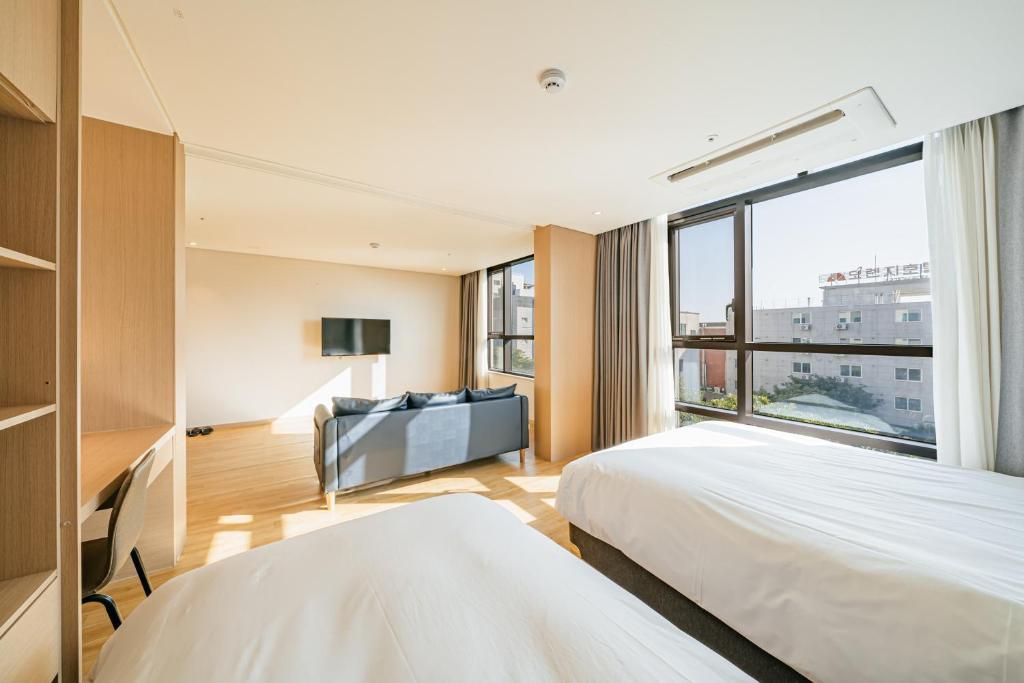 Postel nebo postele na pokoji v ubytování Hotel Zinc