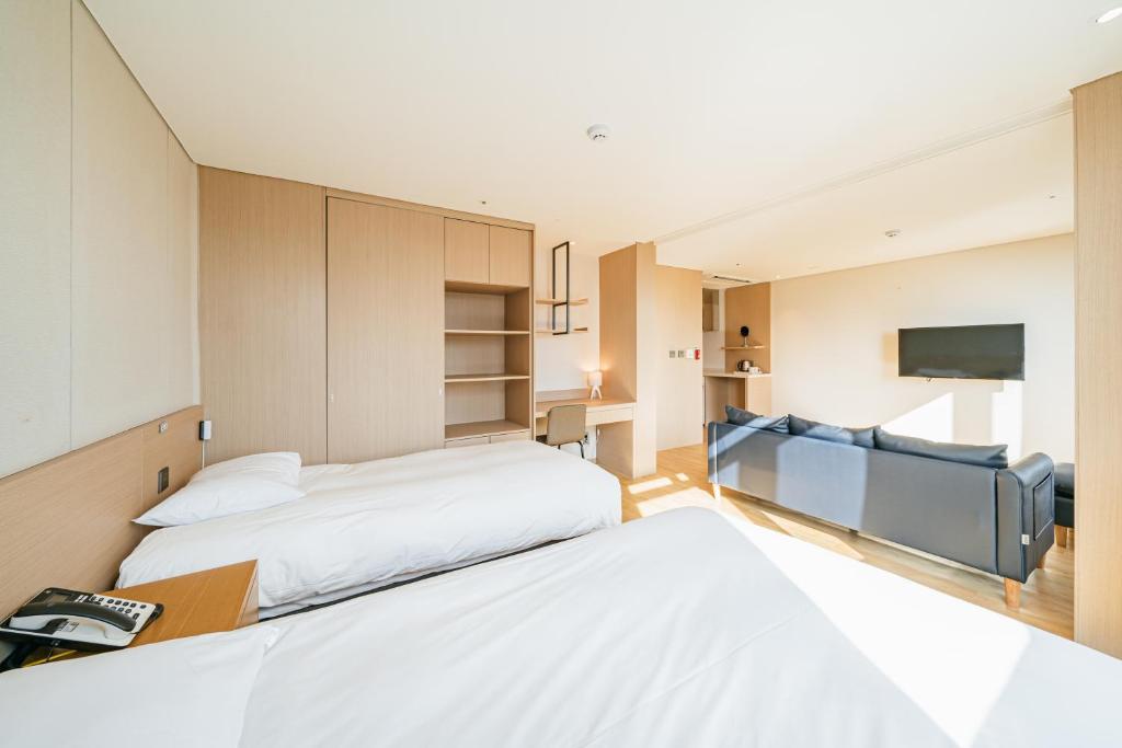 Postel nebo postele na pokoji v ubytování Hotel Zinc