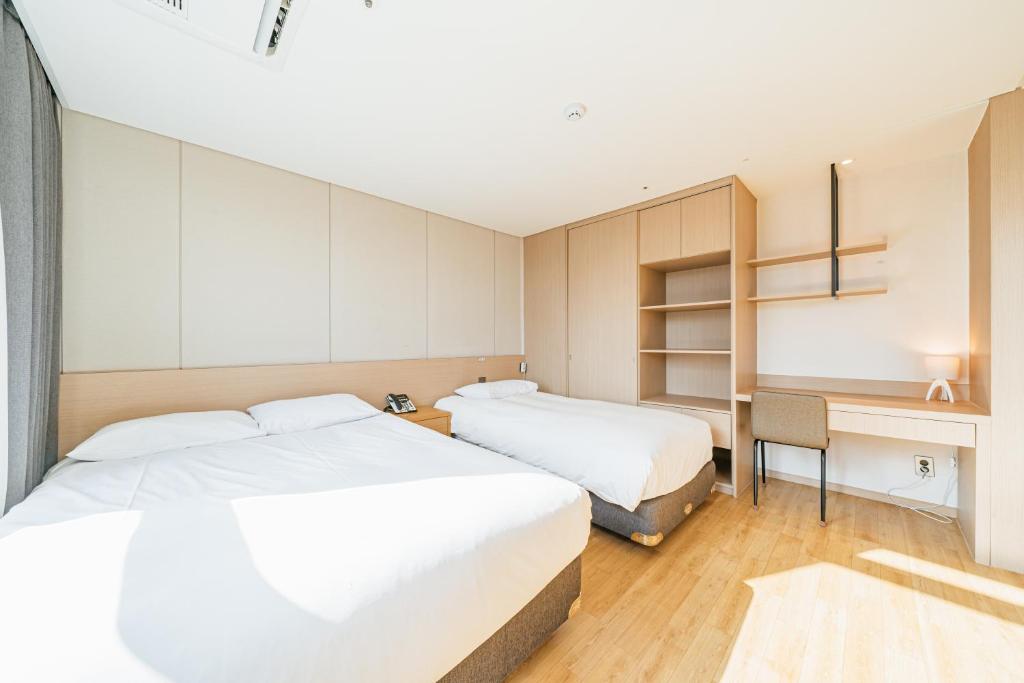 Postel nebo postele na pokoji v ubytování Hotel Zinc