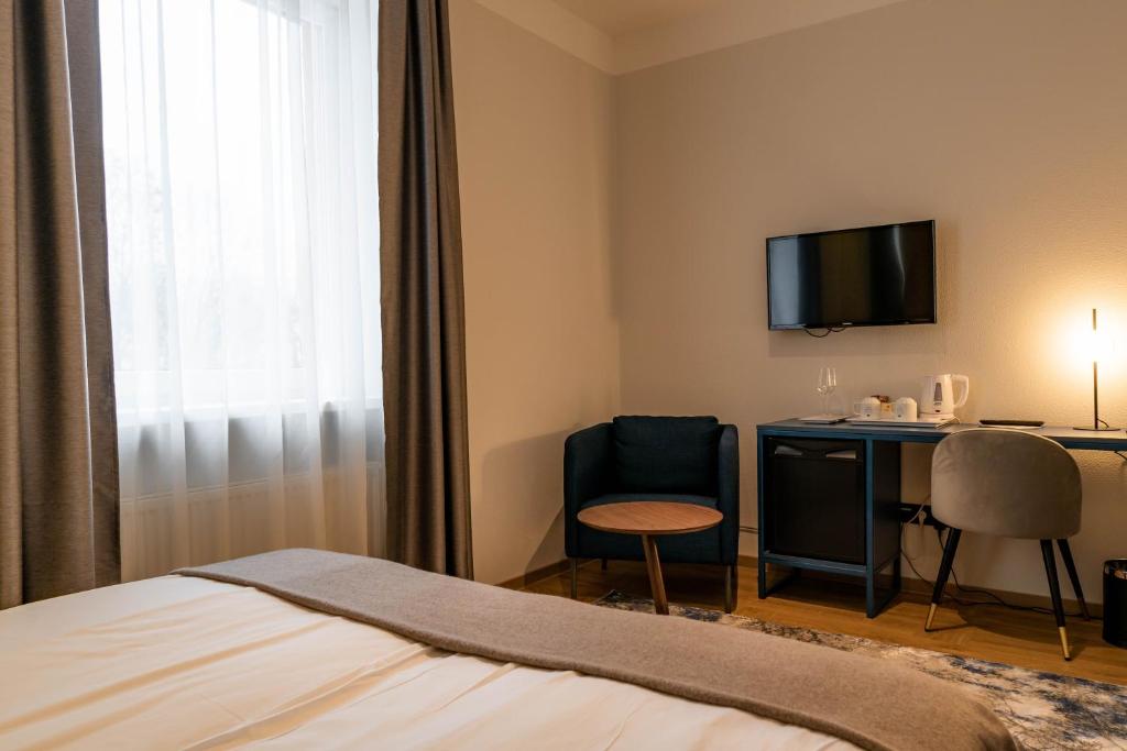 Postel nebo postele na pokoji v ubytování Narva Hotell & Spaa