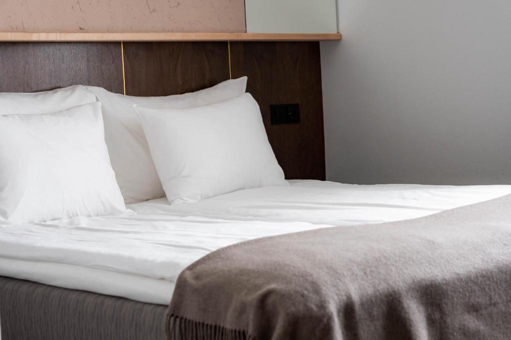 Postel nebo postele na pokoji v ubytování Narva Hotell & Spaa