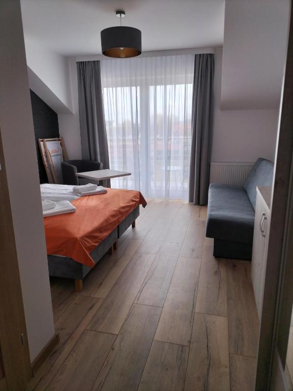 Postel nebo postele na pokoji v ubytování Pensjonat Latino