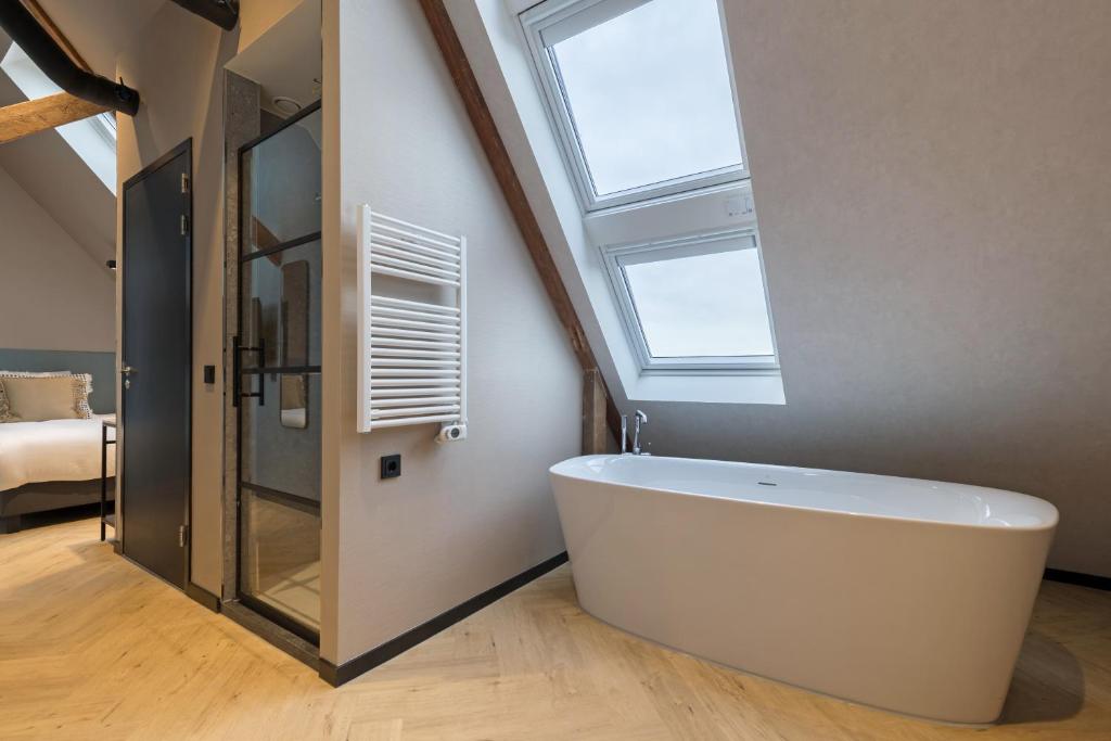 Postel nebo postele na pokoji v ubytování Ocean House Scheveningen
