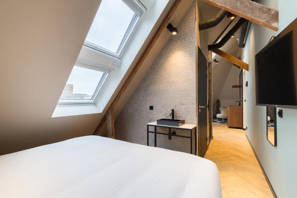 Postel nebo postele na pokoji v ubytování Ocean House Scheveningen