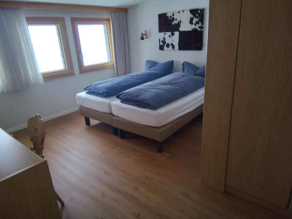 Postel nebo postele na pokoji v ubytování Alpenlodge Kühboden