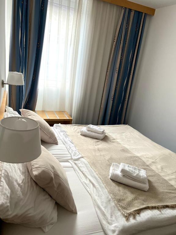 Postel nebo postele na pokoji v ubytování Hotel Jeruzalem