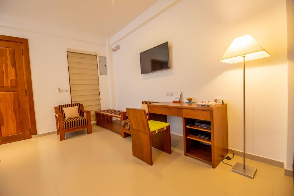 TV a/nebo společenská místnost v ubytování The Residence Hikkaduwa