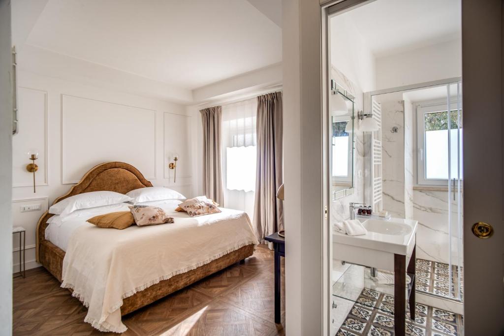 Postel nebo postele na pokoji v ubytování Vigna Caio Relais & Spa
