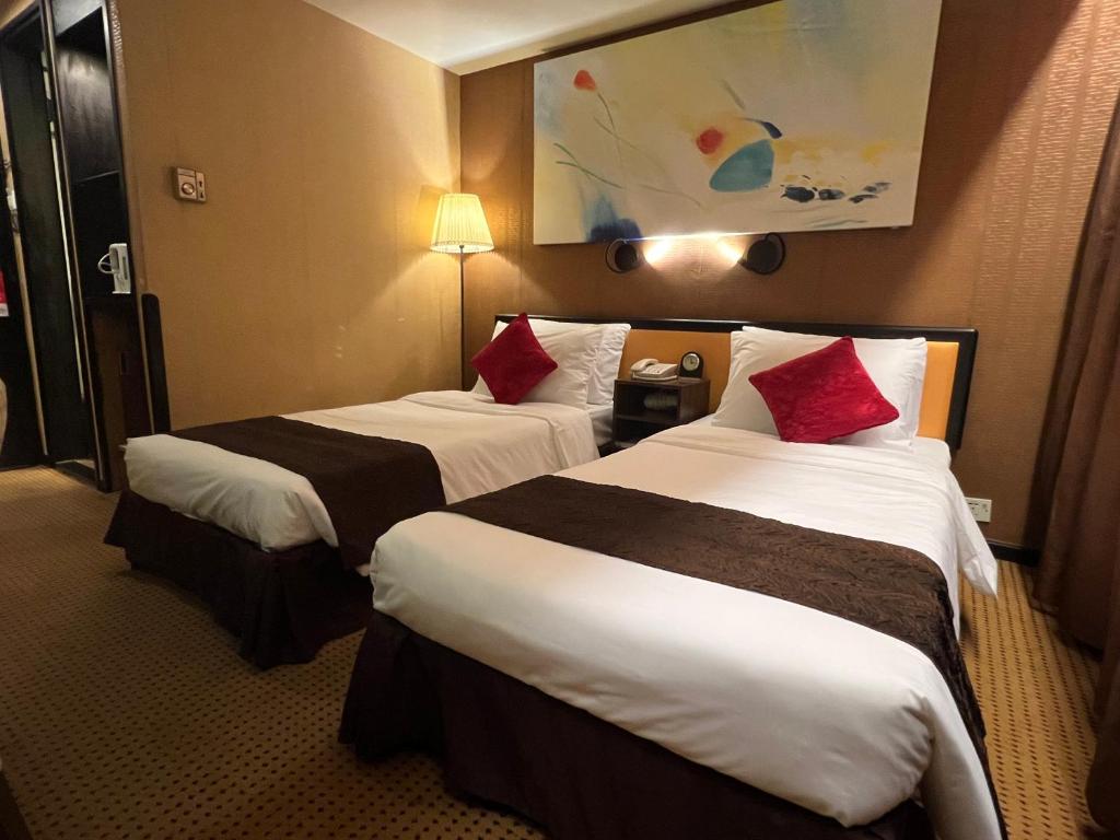Ένα ή περισσότερα κρεβάτια σε δωμάτιο στο Best Western Plus Tsim Sha Tsui
