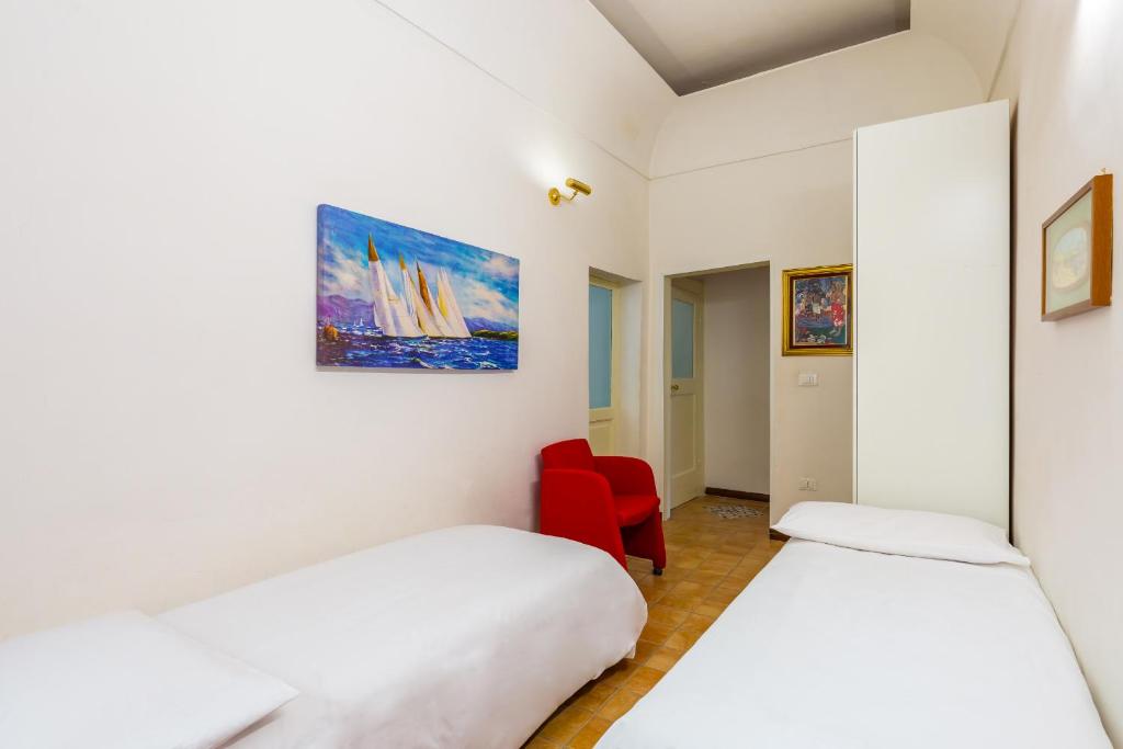 A bed or beds in a room at Appartamento a Santa Maria La Nova by Wonderful Italy