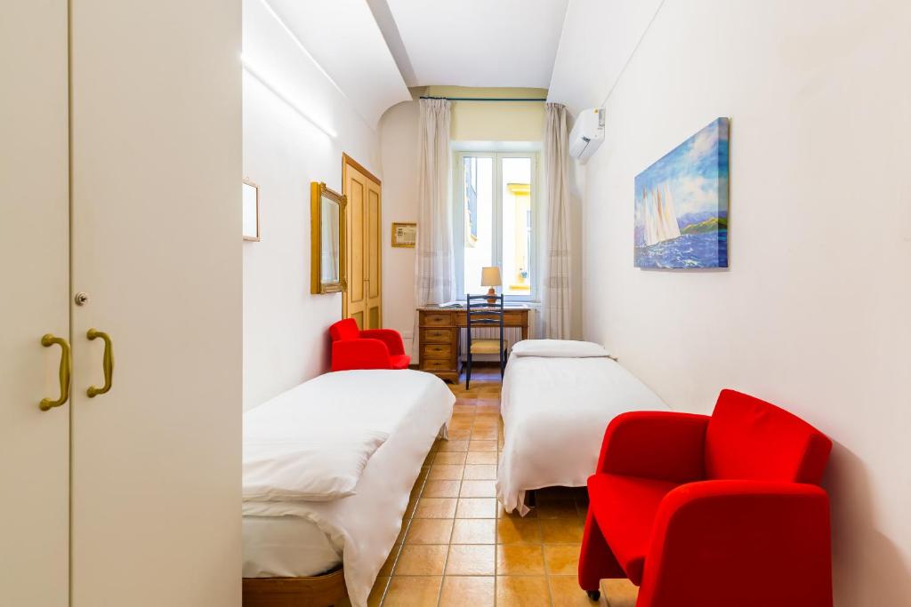 A bed or beds in a room at Appartamento a Santa Maria La Nova by Wonderful Italy
