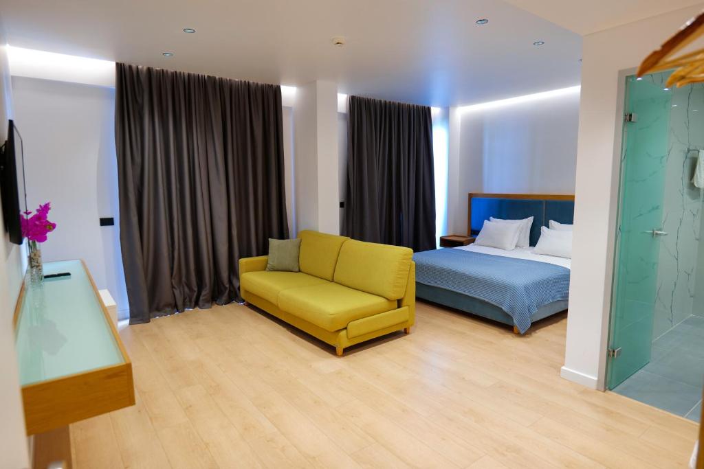 Postel nebo postele na pokoji v ubytování Hotel Nertili