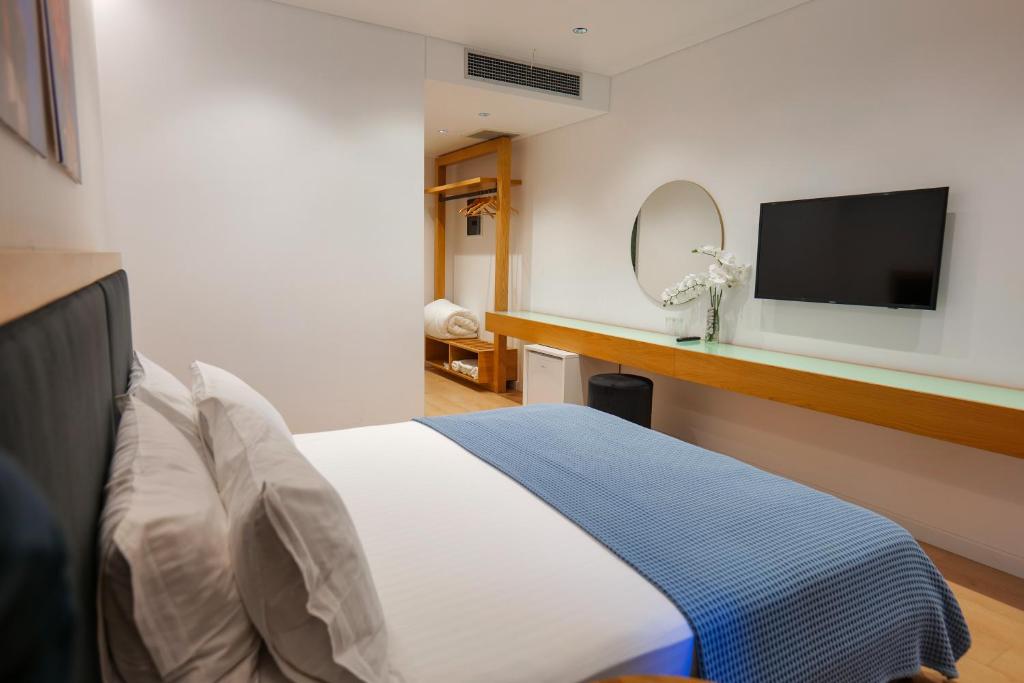 TV a/nebo společenská místnost v ubytování Hotel Nertili