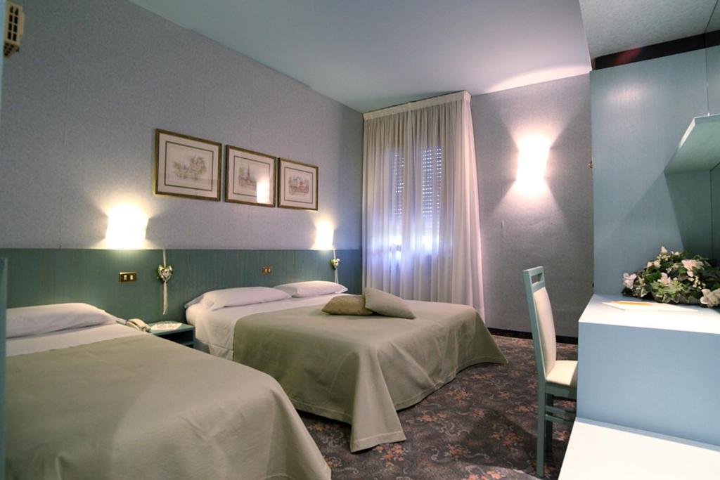 Postel nebo postele na pokoji v ubytování Hotel Globo