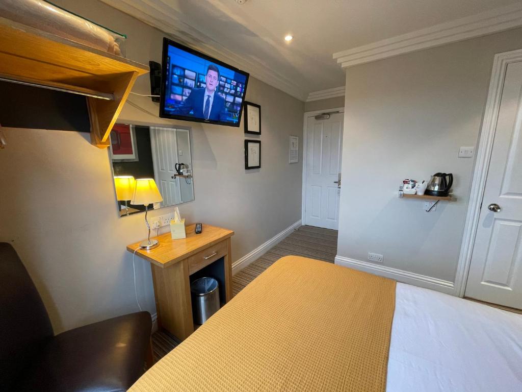 Postel nebo postele na pokoji v ubytování Shandon Hotel
