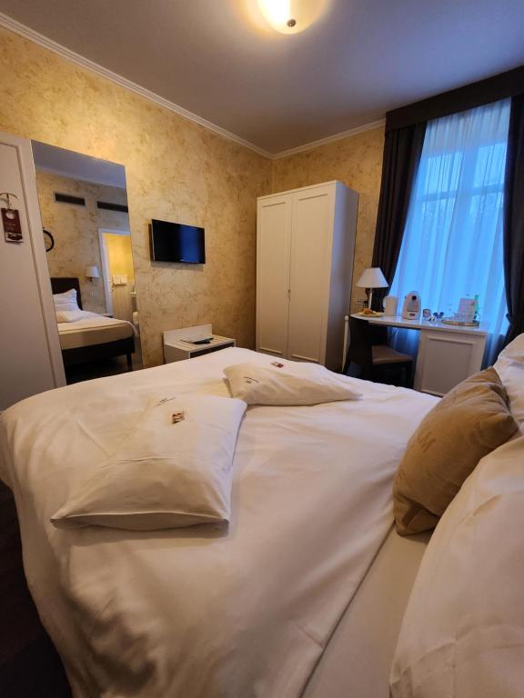 Postel nebo postele na pokoji v ubytování Hotel Millennium
