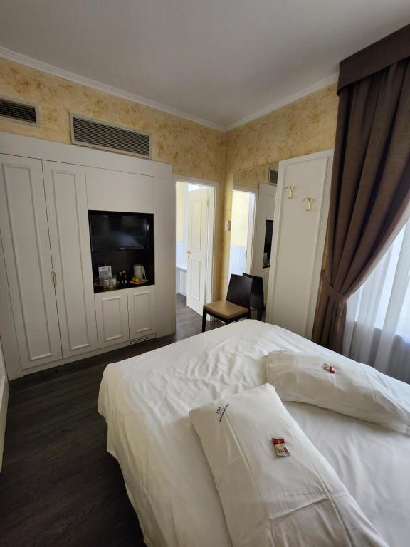 Postel nebo postele na pokoji v ubytování Hotel Millennium