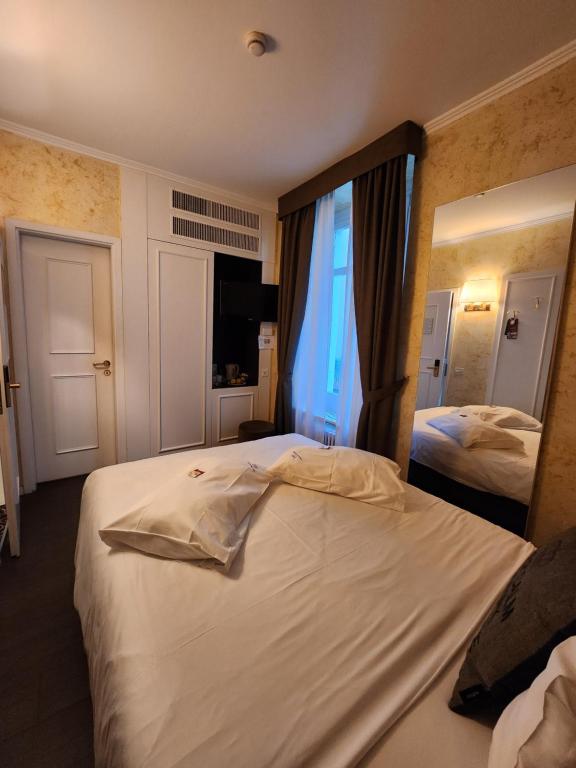 Postel nebo postele na pokoji v ubytování Hotel Millennium