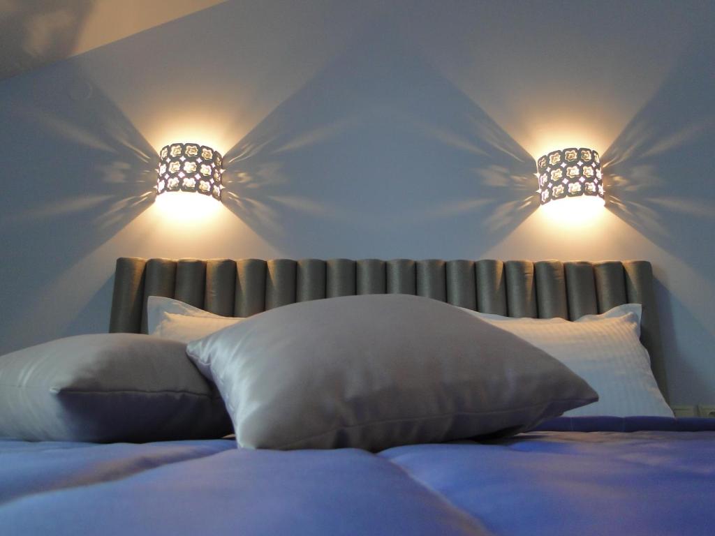 Postel nebo postele na pokoji v ubytování Hotel Olympos