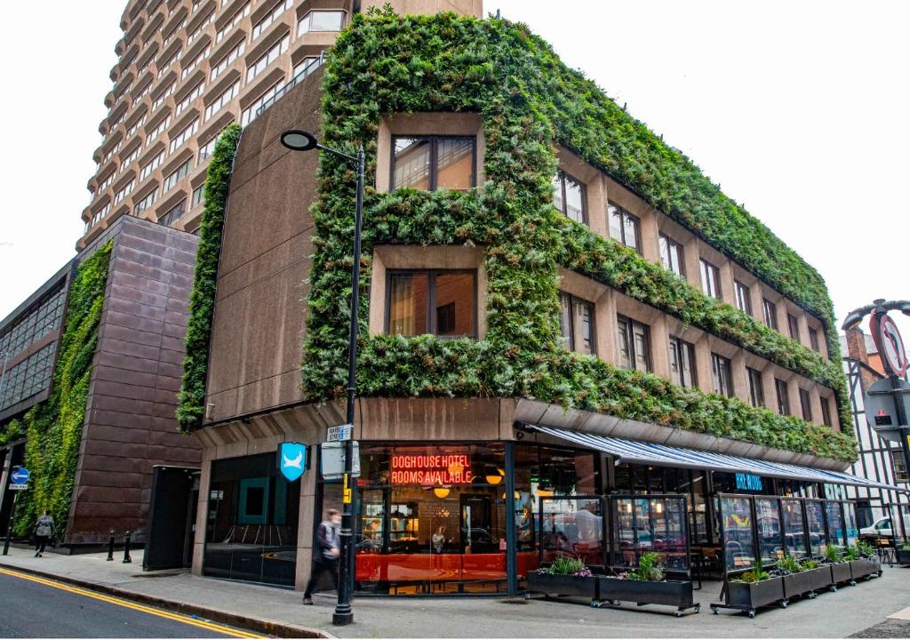 a building with plants growing on the side of it at BrewDog DogHouse Manchester in Manchester