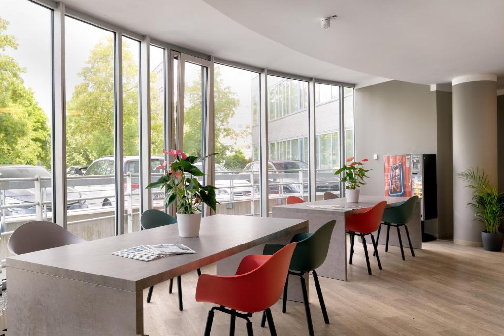 Ein Restaurant oder anderes Speiselokal in der Unterkunft Tulip Inn München Messe 
