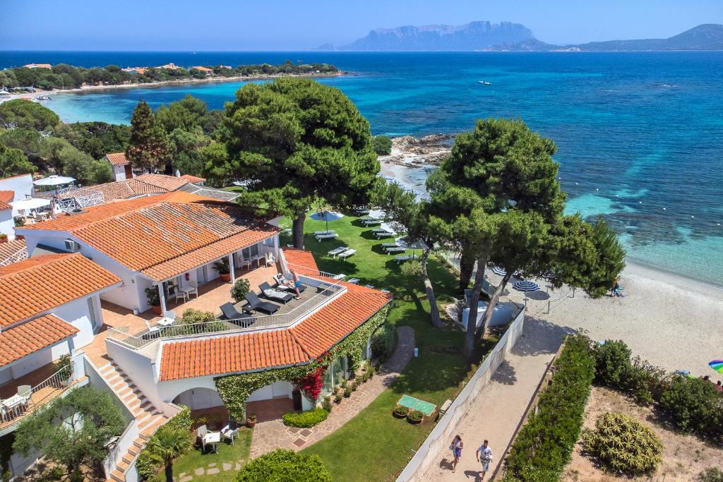 an aerial view of a house on the beach at The Pelican Beach Resort & SPA - Adults Only in Olbia