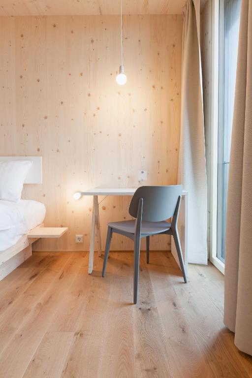 Postel nebo postele na pokoji v ubytování Bader Hotel
