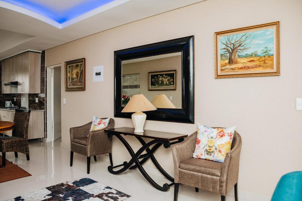Χώρος καθιστικού στο Gosheni Villas
