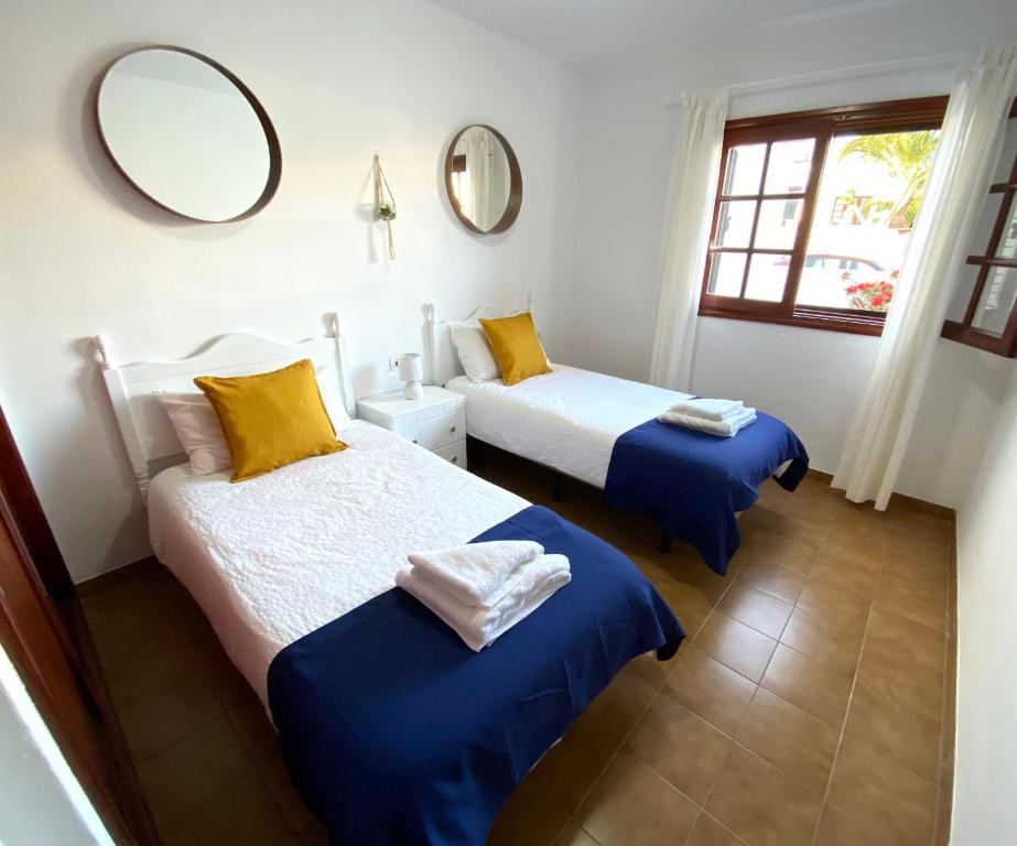 Posteľ alebo postele v izbe v ubytovaní Apartamento Natalia
