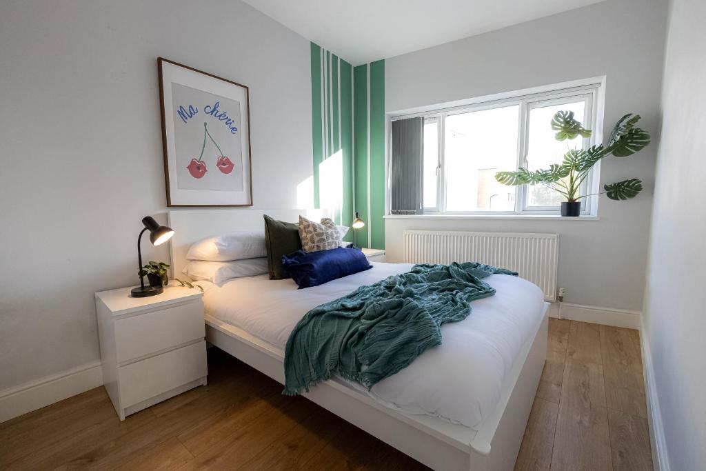 a bedroom with a bed and a window at Camden Apartments Next to Market and Tube Station in London