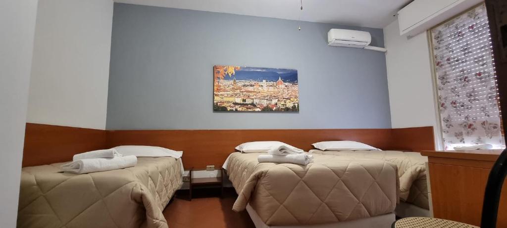 Postel nebo postele na pokoji v ubytování Hotel Indicatore