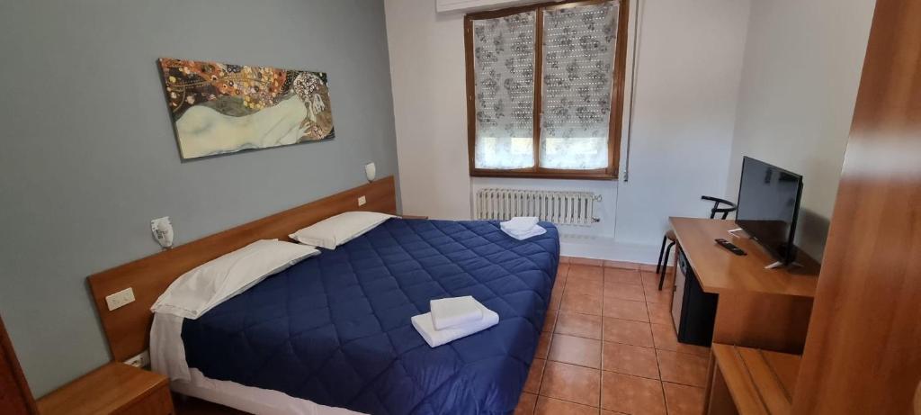 Postel nebo postele na pokoji v ubytování Hotel Indicatore